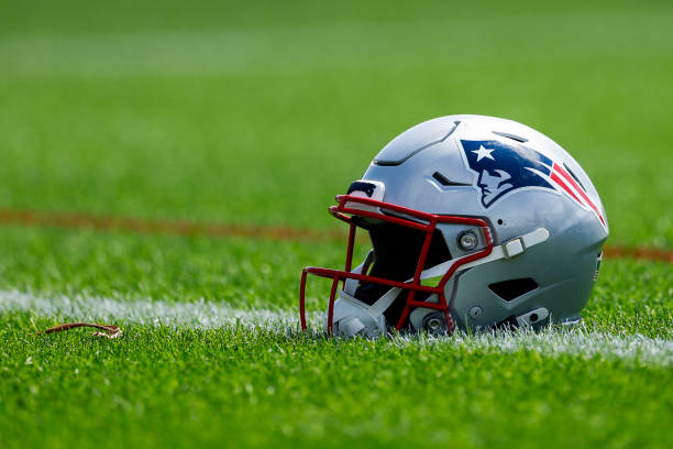 A New England Patriots helmet on the practice field. (Photo by Kayla Bartkowski/The